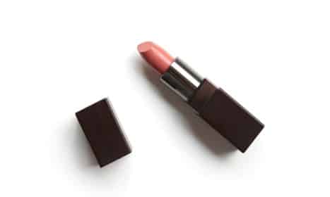 red lipstick on white surface