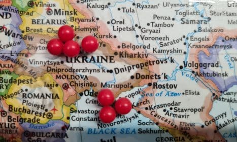 a map with a bunch of red balls on it