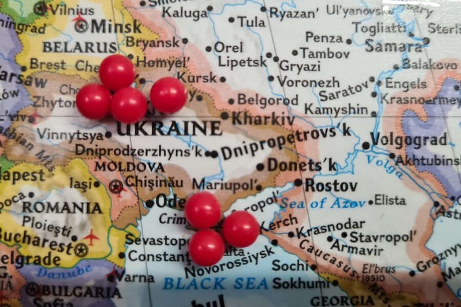 a map with a bunch of red balls on it