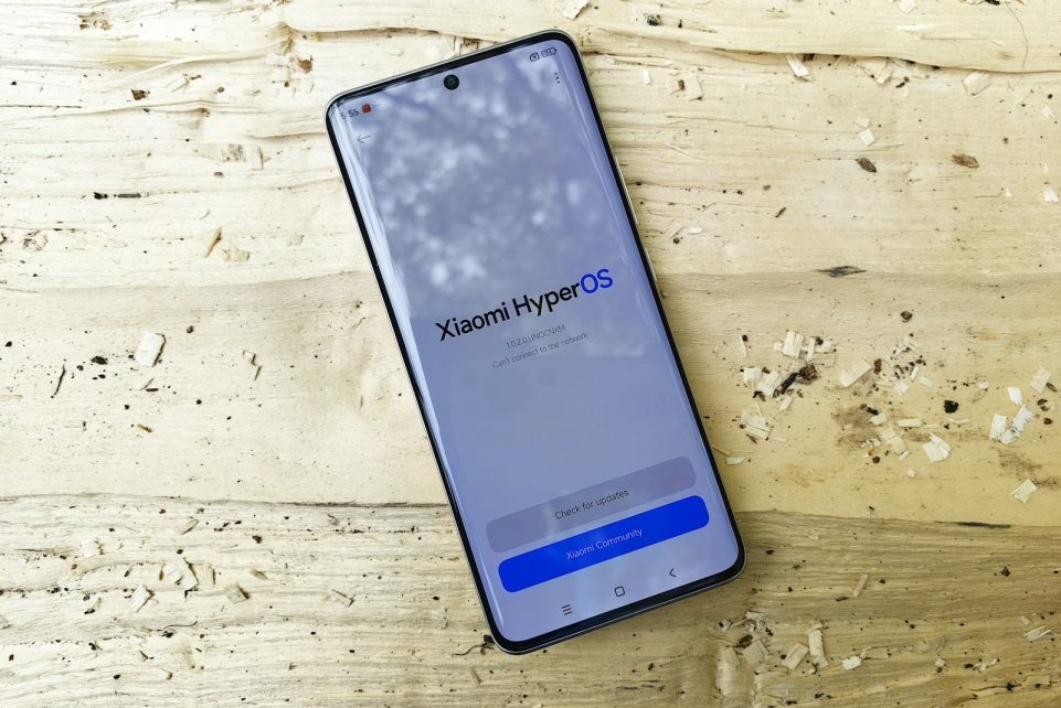 A cell phone sitting on top of a wooden table