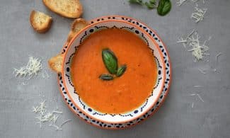 brown soup on white and blue ceramic bowl