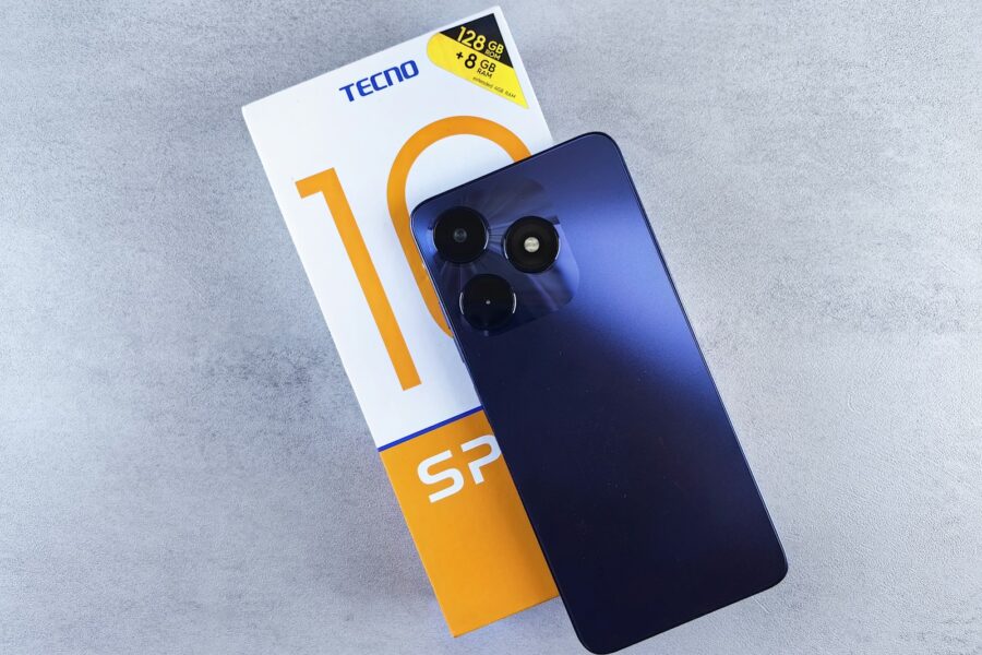 a blue cell phone sitting on top of a box