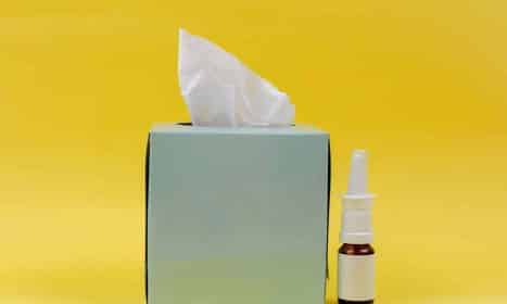 white and brown bottle beside white tissue box