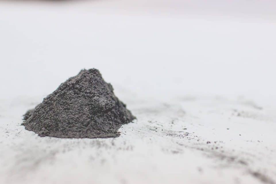 a pile of dirt sitting on top of a white surface