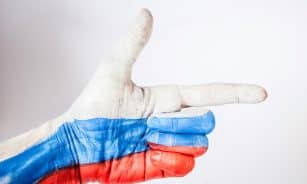 persons hand with blue paint