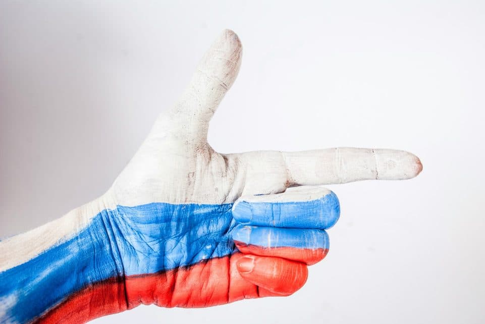 persons hand with blue paint