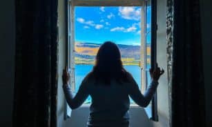 a person looking out a window