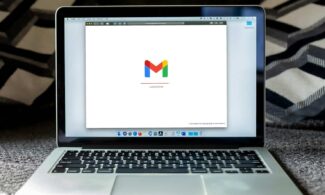 macbook pro on black textile