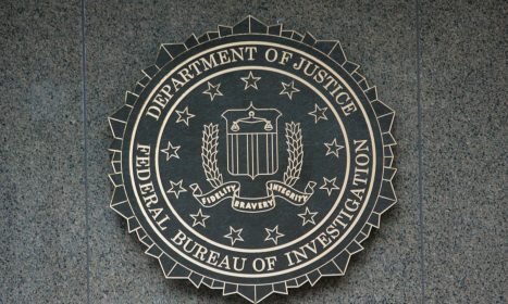 the seal of the department of justice on a wall