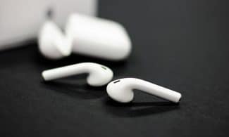 a pair of ear buds sitting on top of a table