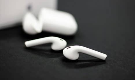 a pair of ear buds sitting on top of a table