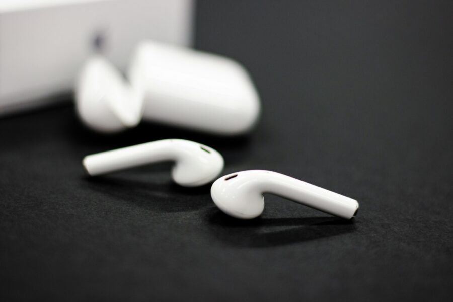 a pair of ear buds sitting on top of a table