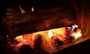 fire in brown wood burner