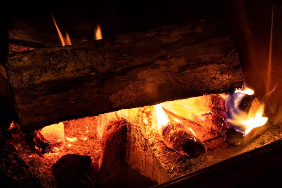 fire in brown wood burner