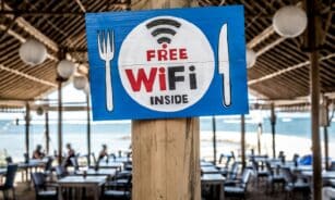 Free WiFi signage on wooden post