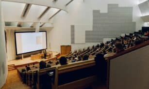 people sitting on chair in front of computer
