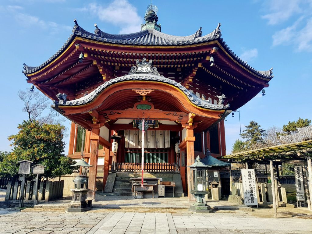 a tall building sitting on top of a stone floor
