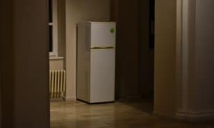 a white refrigerator freezer sitting inside of a kitchen
