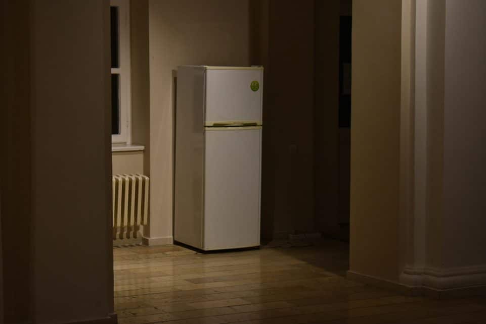 a white refrigerator freezer sitting inside of a kitchen