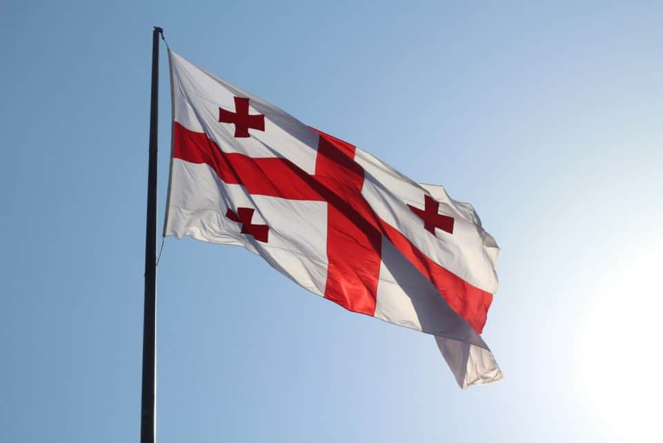 red and white flag on pole