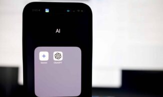 a close up of a cell phone with an ai button