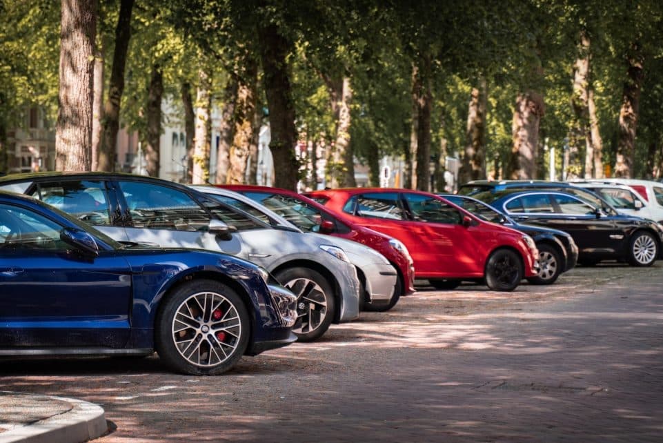 blue and red sports car on road during daytime