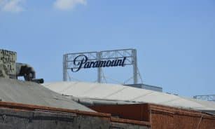 Paramount studios' sign stands against the blue sky.