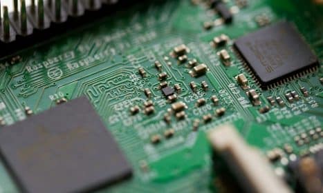 tilt-shift photography of green computer motherboard