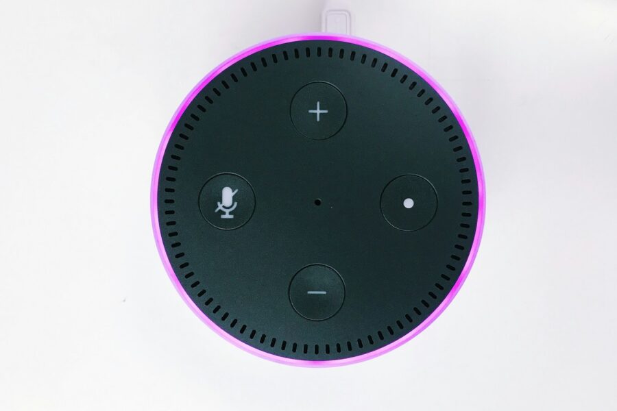 2nd gen. black and purple Amazon Echo Dot on white surface