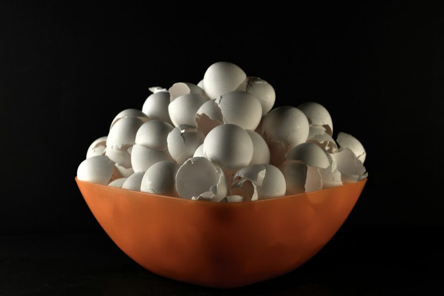 white egg on orange bowl