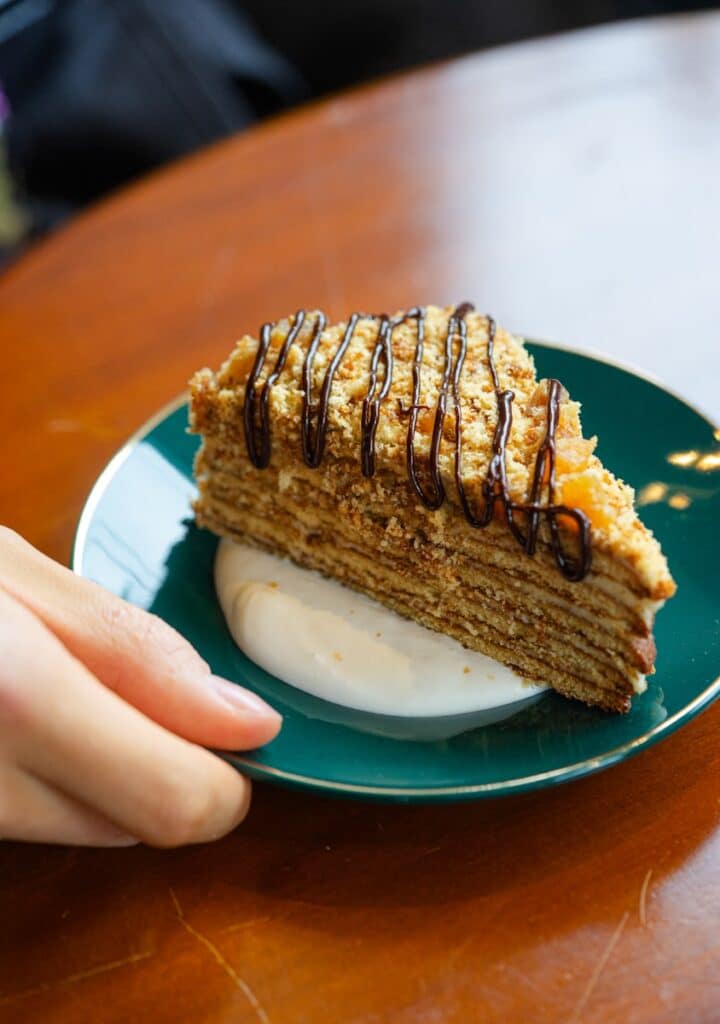 a piece of cake sitting on top of a green plate