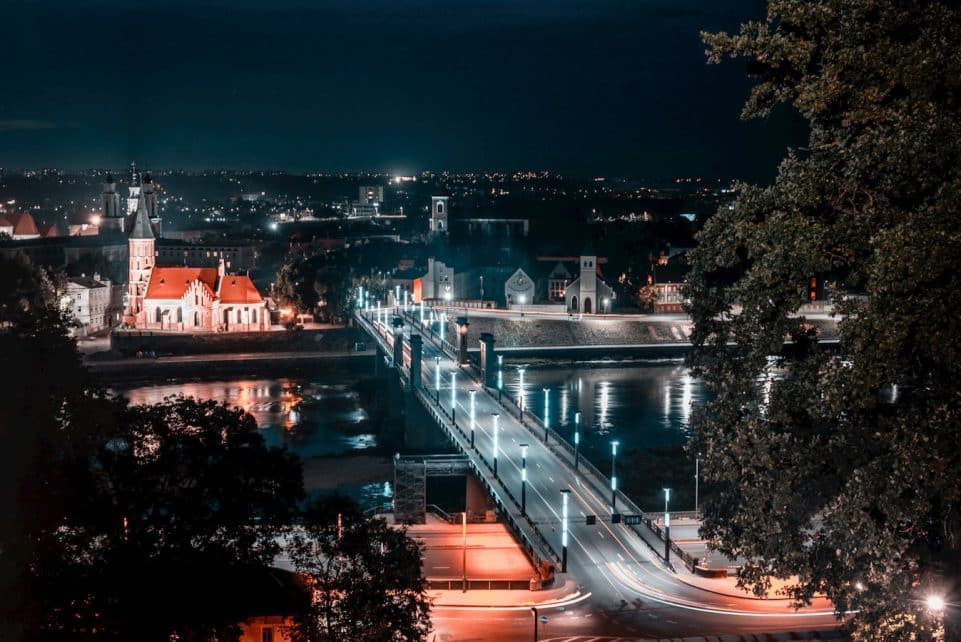 a view of a city at night from a hill