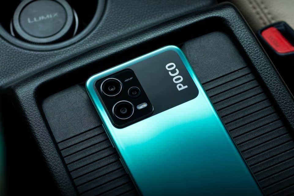 a close up of a cell phone in a car
