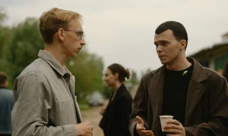 a couple of men standing next to each other