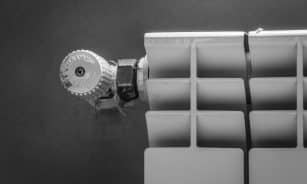 silver round coin on white plastic case