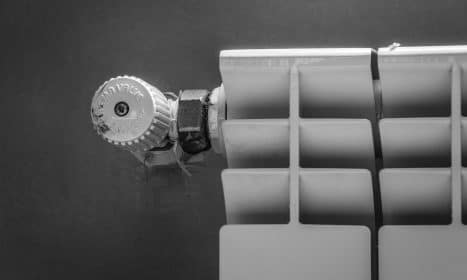 silver round coin on white plastic case