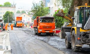 orange truck on road during daytime