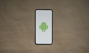 a cell phone with a green icon on it