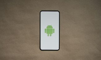 a cell phone with a green icon on it