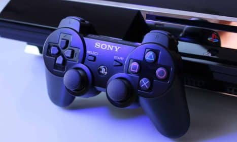 black Sony PS2 controller on white surface