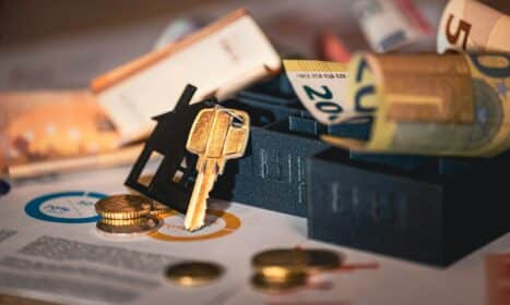 A pile of money sitting on top of a table