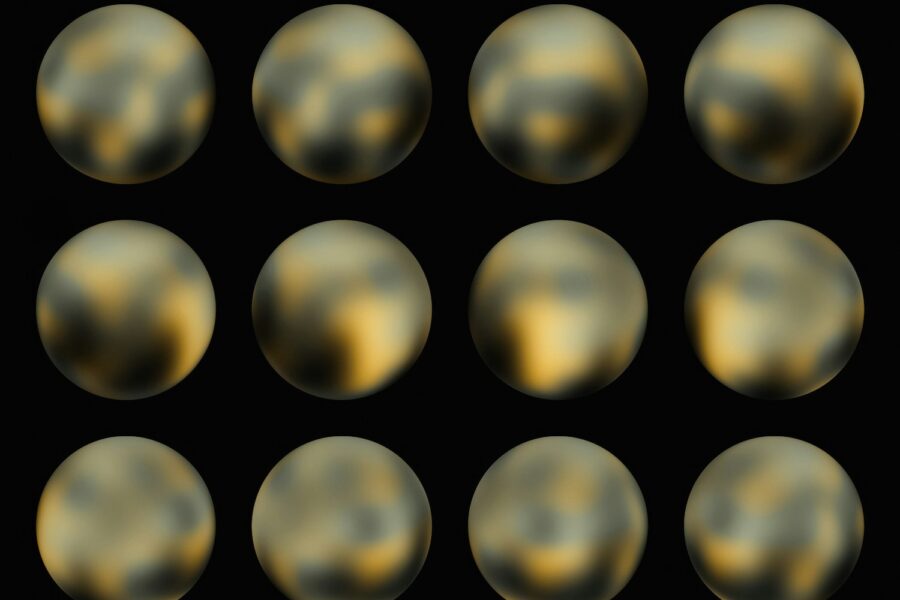 a set of nine shiny balls on a black background