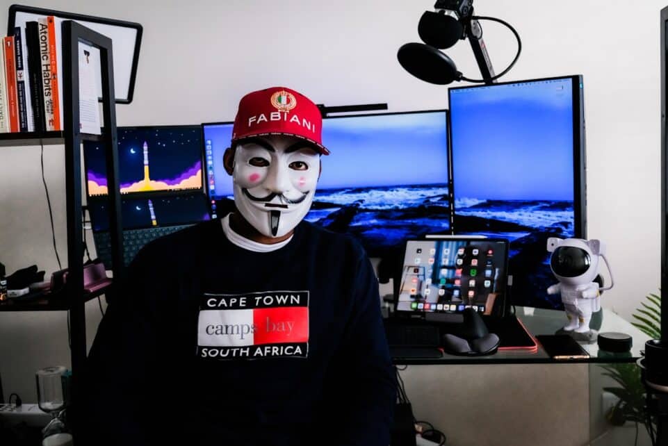 a person wearing a mask and a red hat