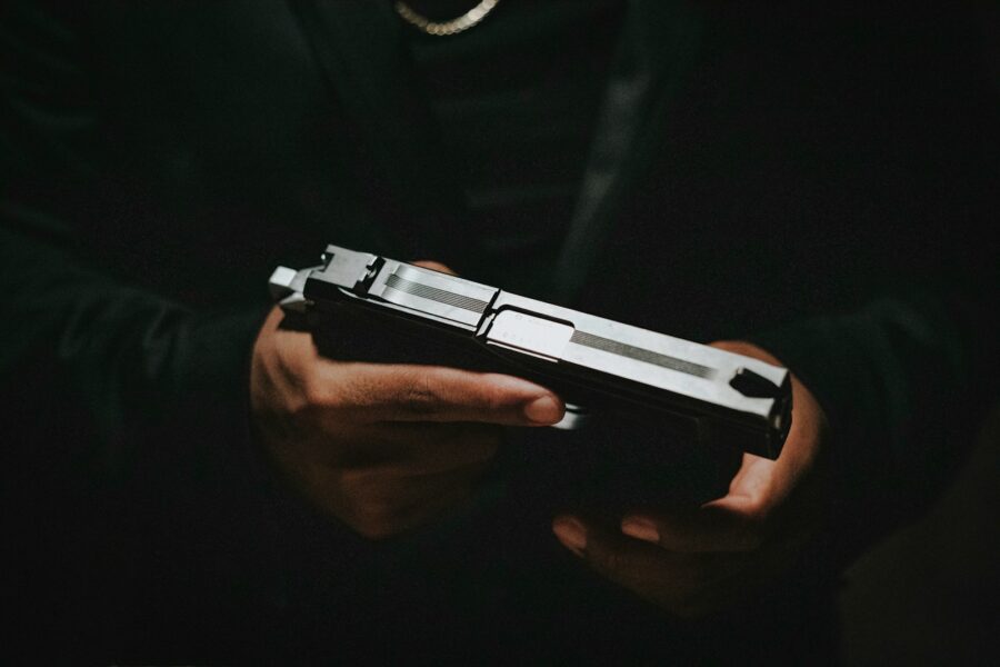 a person holding a gun in their hands