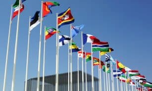 a bunch of flags that are flying in the air
