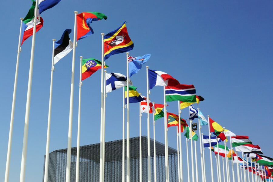 a bunch of flags that are flying in the air