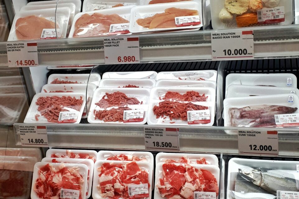 A display case filled with lots of different types of meat