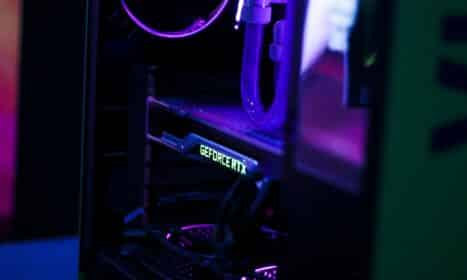 a close up of a computer with a purple light