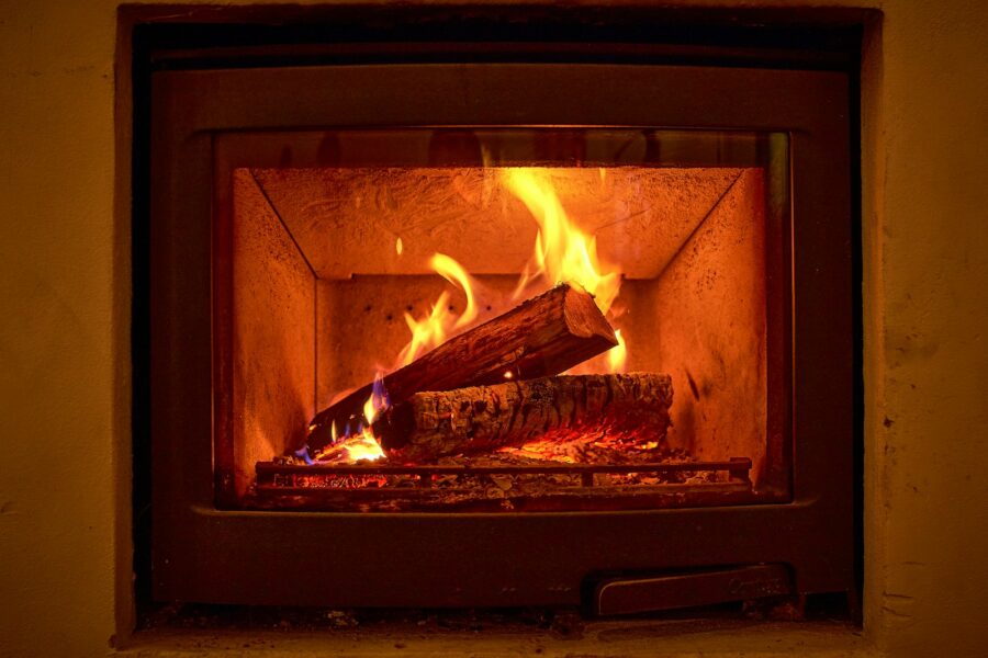 brown wood burning in fire pit