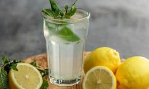 lime juice on drinking glass beside sliced limes
